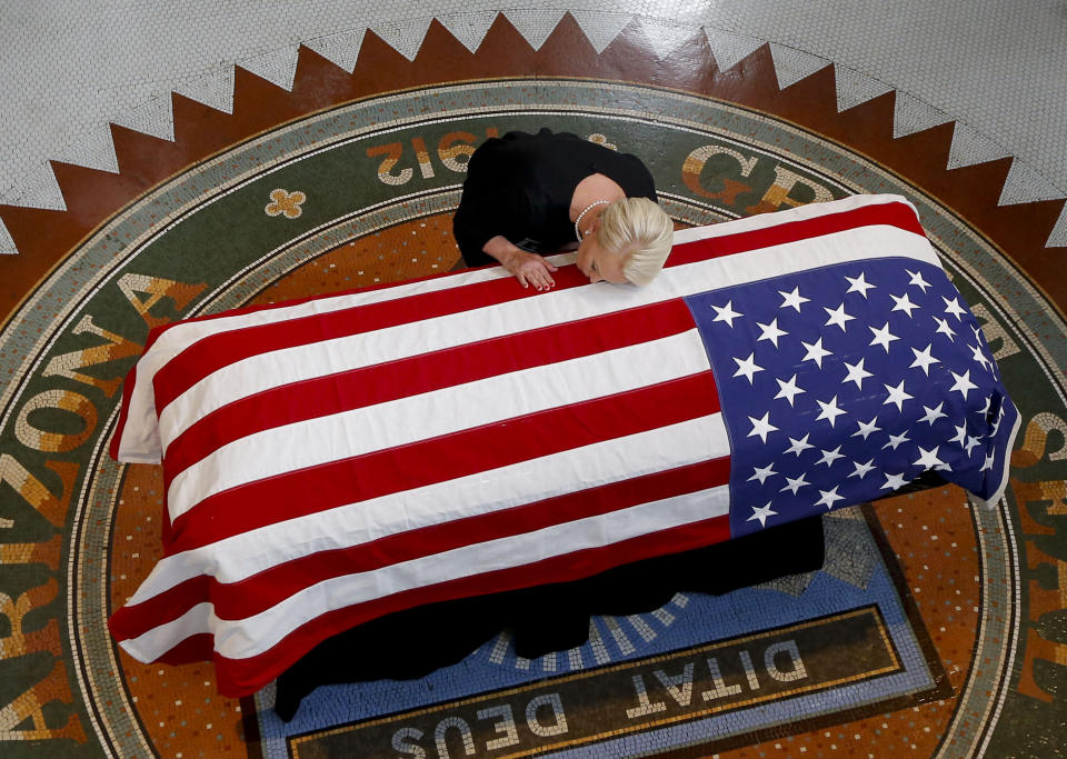 Cindy McCain kisses the casket of her husband, Sen. John McCain, during a memorial service in Phoenix at the state Capitol, Aug. 29. (Photo: ROSS D. FRANKLIN / Getty Images)