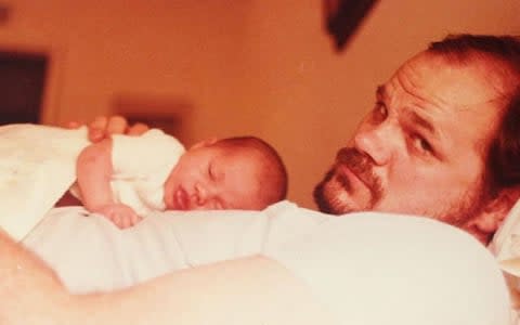 Baby Meghan Markle lies on the chest of her father Thomas - Credit: TIM STEWART NEWS LIMITED 