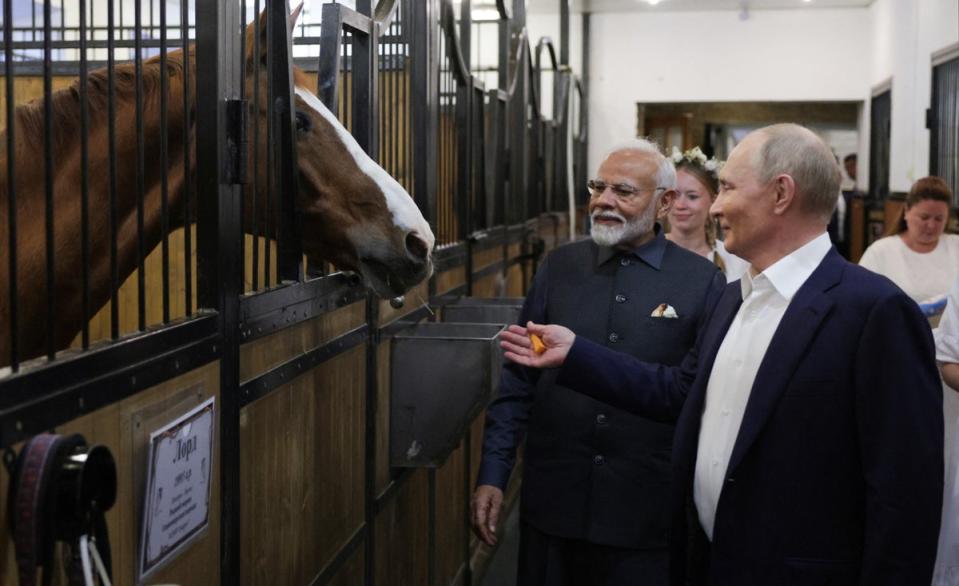 Putin and Modi visit the Russian leader’s stables (POOL/AFP via Getty Images)