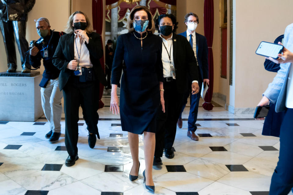 Nancy Pelosi arrived at the House of Representatives for impeachment proceedings against President Trump wearing the same dark suit she wore to his first impeachment trial in Dec. 2019. 