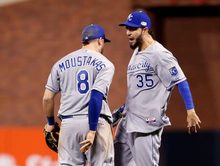 Oct 24, 2014; San Francisco, CA, USA; Kansas City Royals infielders Mike Moustakas (8) and Eric Hosmer (35) celebrate after defeating the San Francisco Giants during game three of the 2014 World Series at AT&T Park. Mandatory Credit: Kelley L Cox-USA TODAY Sports