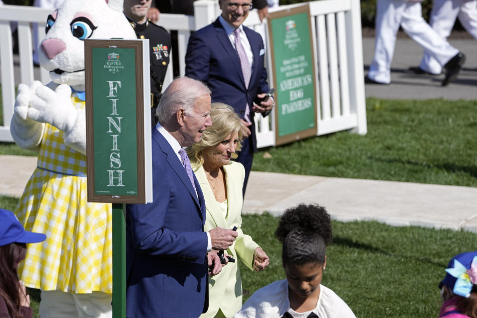 President Joe Biden and first lady Jill Biden hold whistles as they arrive to participate in the 2023 White House Easter Egg Roll, Monday, April 10, 2023, in Washington. (AP Photo/Susan Walsh)