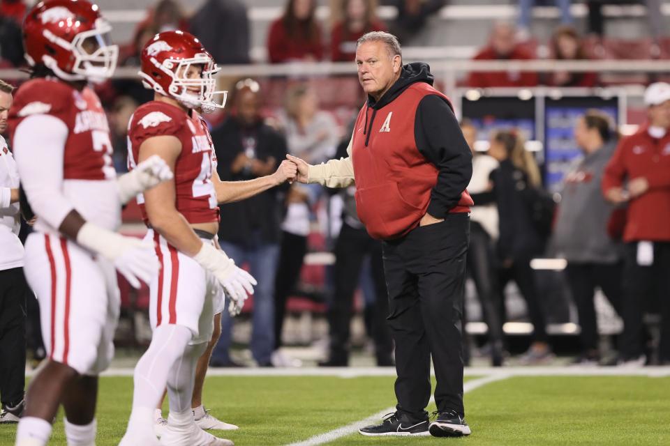 Nov 18, 2023; Fayetteville, Arkansas, USA; Arkansas Razorbacks head coach Sam Pittman shakes hands with his players prior to the game against the FIU Panthers at Donald W. Reynolds Razorback Stadium. Mandatory Credit: Nelson Chenault-USA TODAY Sports