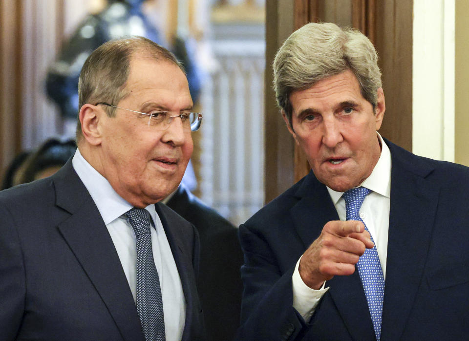 Russian Foreign Minister Sergey Lavrov, left, and U.S. climate envoy John Kerry enter a hall for their talks during in Moscow, Russia, Monday, July 12, 2021.(Dimitar Dilkoff/Pool Photo via AP)