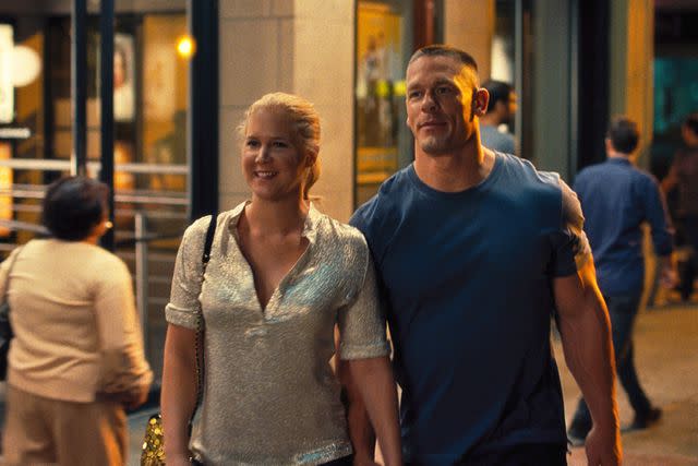 <p>Universal Pictures</p> Amy Schumer and John Cena in 'Trainwreck'