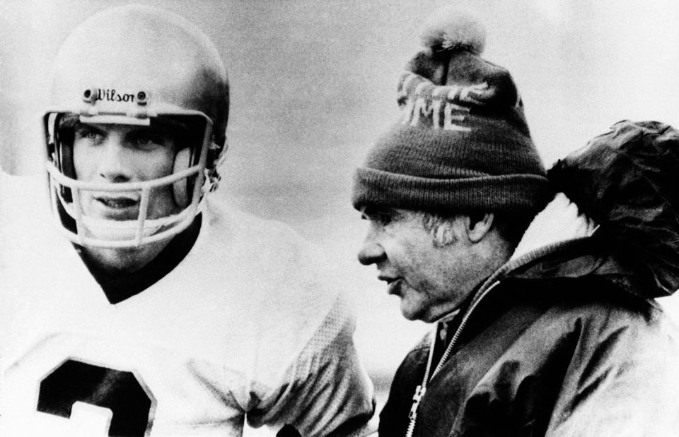 Notre Dame's quarterback Joe Montana gets last minute talk with head Coach Dan Devine in closing minutes of game with the University of Houston at Cotton Bowl Classic on Monday, Jan. 2, 1979 in Dallas, Texas. Notre Dame won the hard-fowl game 35- 34.