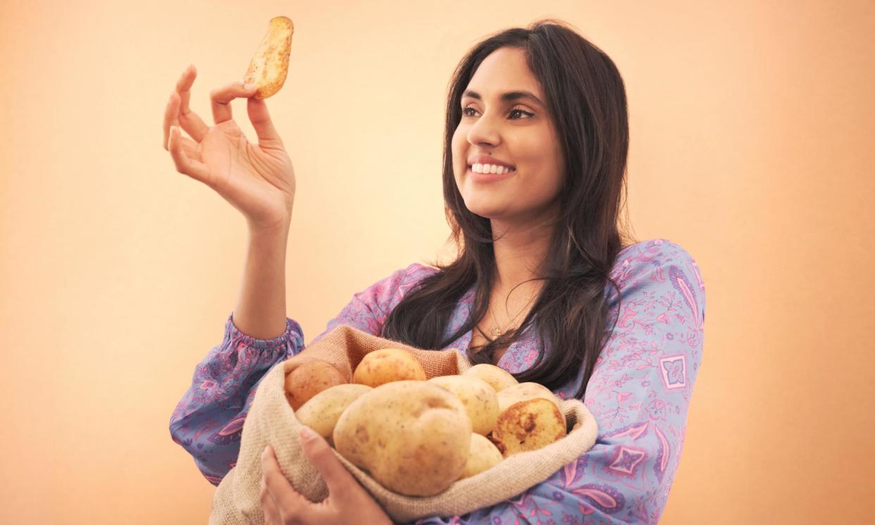 <span>Ravneet Gill gets set for the crisp taste test.</span><span>Photograph: Phil Fisk/The Observer</span>