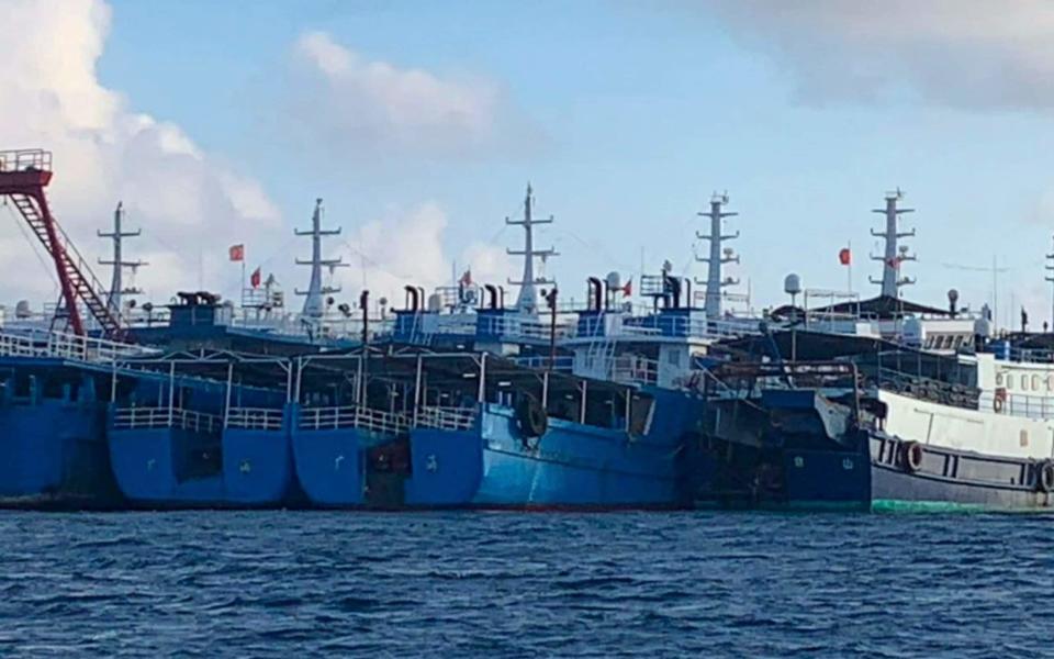 China says vessels gathered at the Whitsun reef are sheltering from rough seas - National Task Force - West Philippine Sea/AP