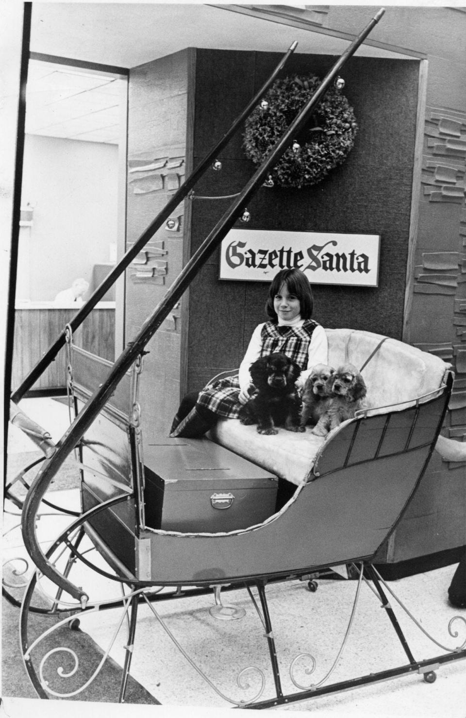 The sleigh was a familiar sight each holiday, set up in the lobby of the former home of the Telegram & Gazette at 20 Franklin St. Often a picture was taken when people dropped off a donation. Pictured in 1978 is Kimberly Thayer of Princeton (and friends), who dropped off a donation from the Worcester County Kennel Club.