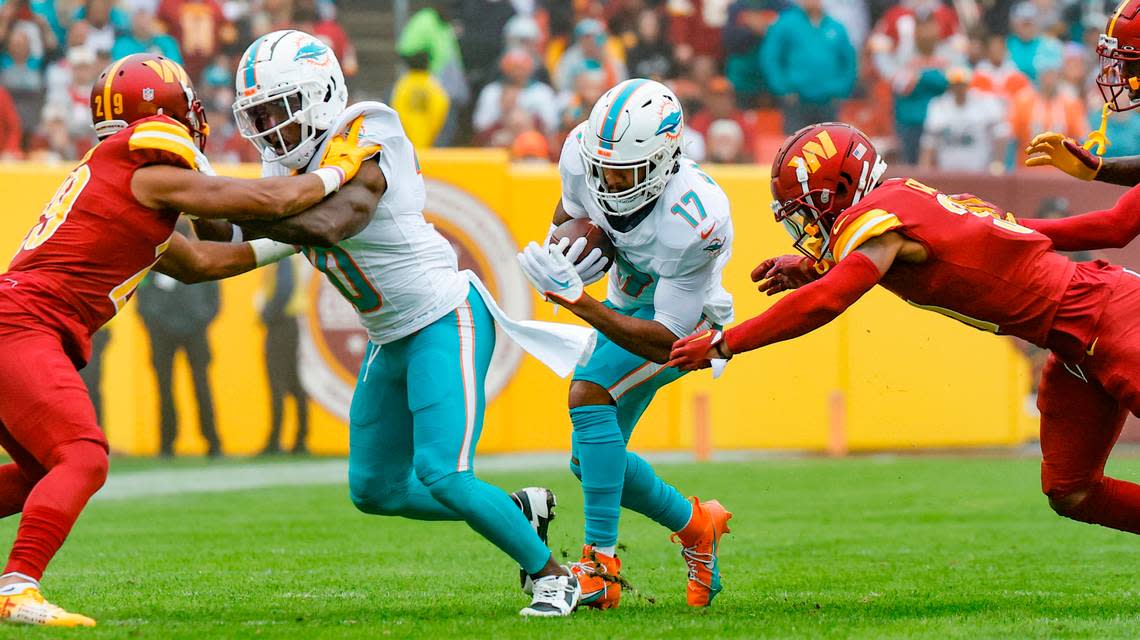 Miami Dolphins wide receiver Tyreek Hill (10) blocks for wide receiver Jaylen Waddle (17) in the first half against the Washington Commanders at FedEx Field in Landover, Maryland on Sunday, December 3, 2023.