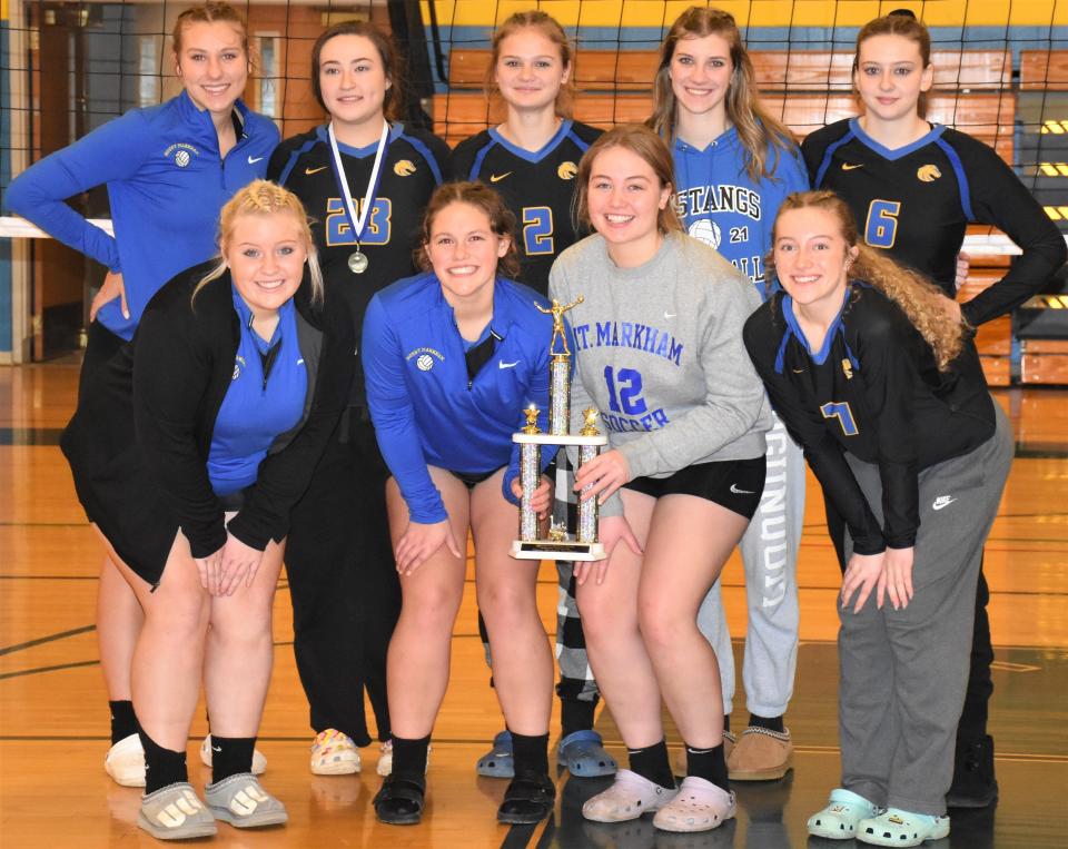 The Mt. Markham Mustangs pose with their Silver Division championship trophy following the Mt. Markham Tournament Saturday.