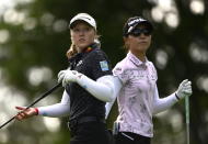 Canada's Brooke Henderson, left, passes New Zealand's Lydia Ko, right, during the first round of the CP Women's Open golf tournament, Thursday, Aug. 25, 2022, in Ottawa, Ontario. (Justin Tang/The Canadian Press via AP)