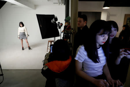 Nao Niitsu, 19, a college freshman from Tokyo, who wants to be a K-pop star, chooses her profile picture before an audition in Seoul, South Korea, March 16, 2019. REUTERS/Kim Hong-Ji