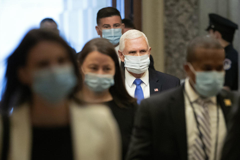 Vice President Mike Pence wears a face mask to protect against the spread of the new coronavirus as he arrives on Capitol Hill in Washington for a meeting with Senate Majority Leader Mitch McConnell of Ky., and Treasury Secretary Steve Mnuchin, Tuesday, May 19, 2020. (AP Photo/Patrick Semansky)
