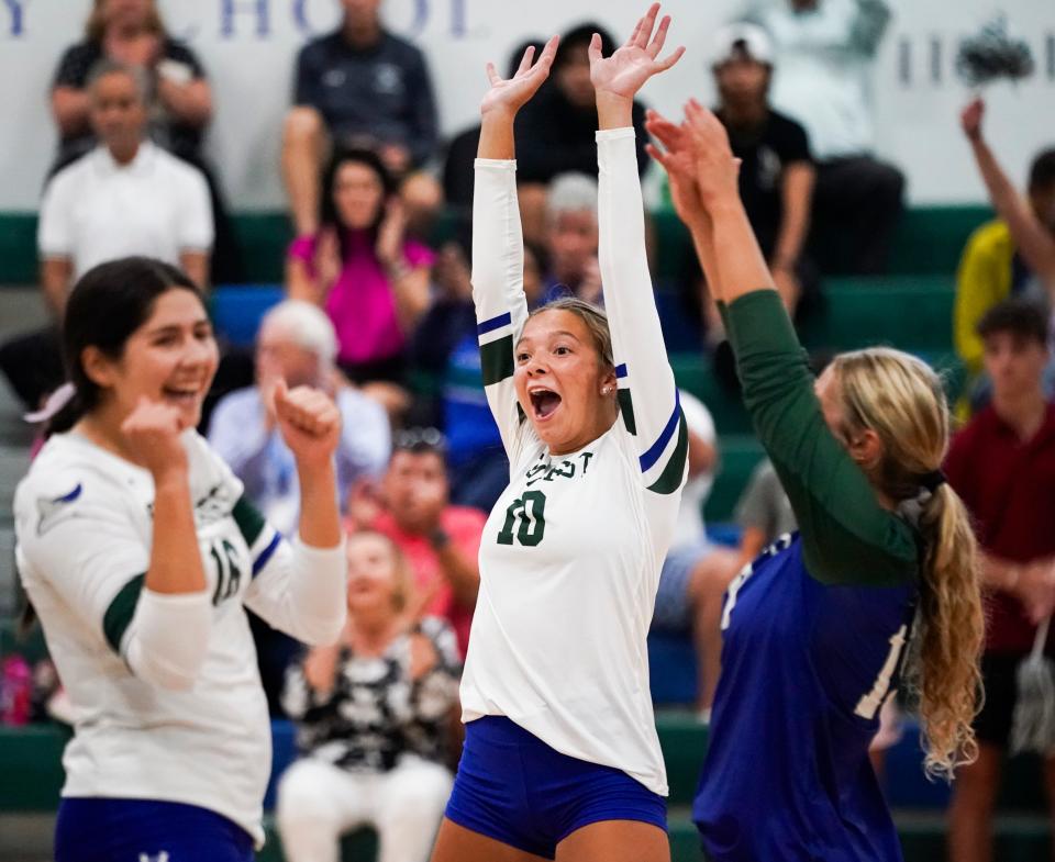 Seacrest Country Day Stingrays setter Milena Lopez (10) and the rest of the team celebrate a point during the season opener at Seacrest Country Day in Naples on Tuesday, Aug. 22, 2023.