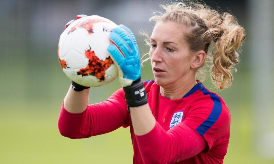 Siobhan Chamberlain in red England shirt, holding the ball