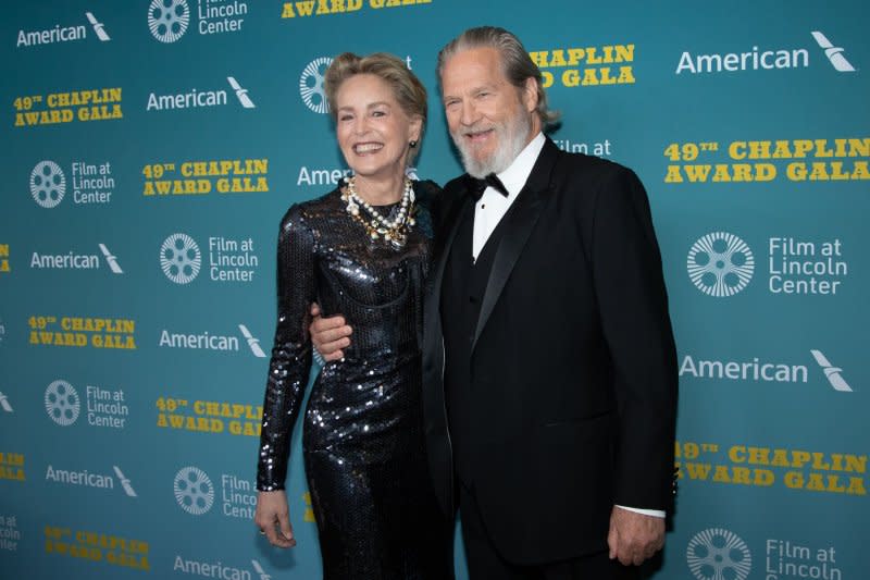 Jeff Bridges (R) and Sharon Stone attend the Chaplin Award gala honoring Bridges on Monday. Photo by Serena Xu Ning/UPI