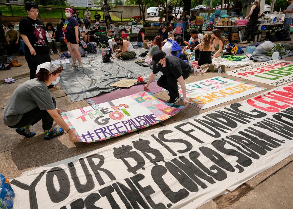 Pro-Palestinian demonstrators placed banners April 30 outside the Travis County Jail as they waited for the release of protesters arrested during an April 29 demonstration at the University of Texas. UT System Chairman Kevin Eltife said UT won't bow to protesters' calls to divest from weapons manufacturers that contribute to Israel.