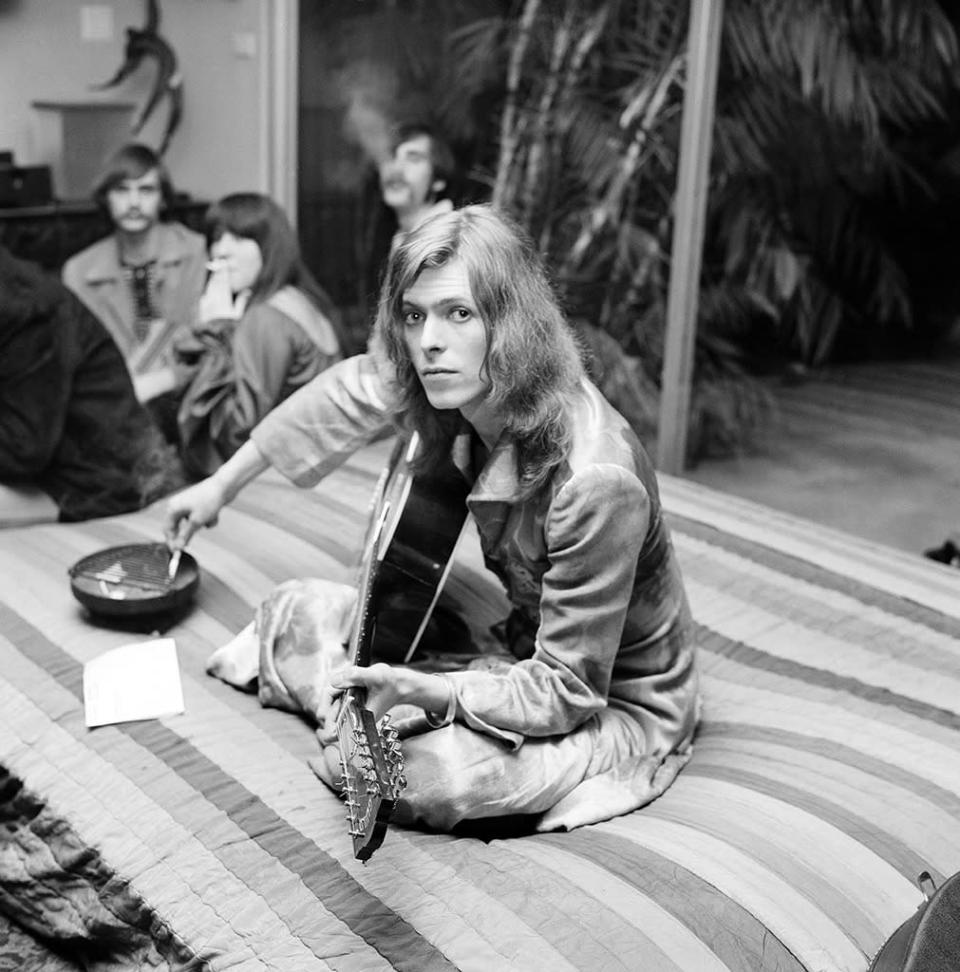 A long-haired Bowie, directly predating his Ziggy Stardust persona, jams at a party thrown by publicist and future nightclub impresario/ DJ Rodney Bingenheimer in January 1971, in Los Angeles.