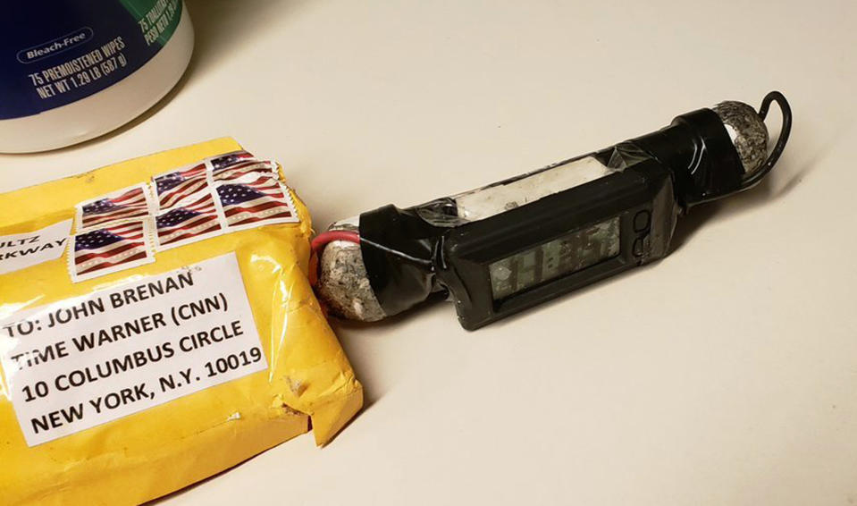 This image obtained Wednesday, Oct. 24, 2018, and provided by ABC News shows a package addressed to former CIA head John Brennan and an explosive device that was sent to CNN's New York office. (ABC News via AP)