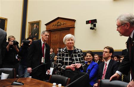 Federal Reserve Chair Janet Yellen (C) arrives to testify before a House Financial Services Committee hearing on "Monetary Policy and the State of the Economy." at the Rayburn House Office Building in Washington, February 11, 2014. REUTERS/Mary F. Calvert