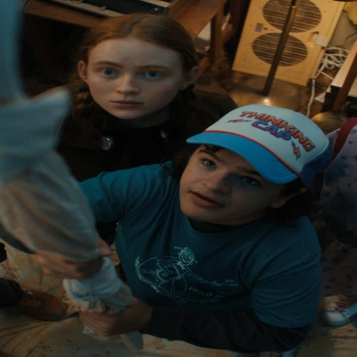 Caleb McLaughlin, Sadie Sink, Gaten Matarazzo, and Priah Ferguson all look up a rope ladder