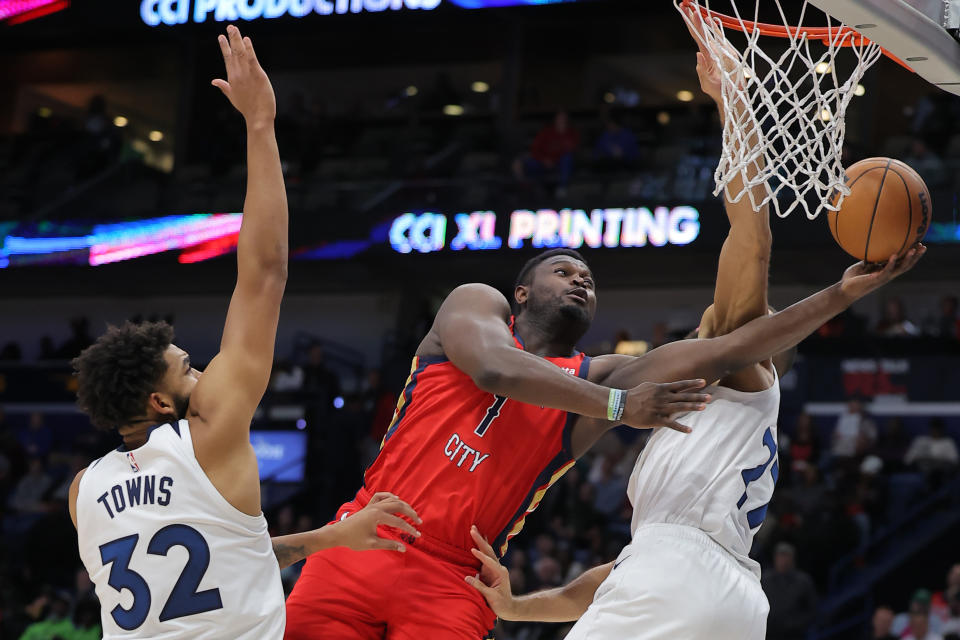 NEW ORLEANS, LOUISIANA - DECEMBER 11: Zion Williamson #1 of the New Orleans Pelicans shoots against Karl-Anthony Towns #32 of the Minnesota Timberwolves  during the second half at the Smoothie King Center on December 11, 2023 in New Orleans, Louisiana. NOTE TO USER: User expressly acknowledges and agrees that, by downloading and or using this Photograph, user is consenting to the terms and conditions of the Getty Images License Agreement. (Photo by Jonathan Bachman/Getty Images)