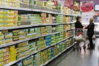 Women chat as they shop inside a supermarket in Beirut