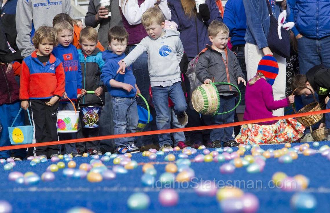 In this 2016 photo, hundreds of kids toting baskets found more than 10,000 Easter eggs on the blue turf of Albertsons Stadium at Boise State University.