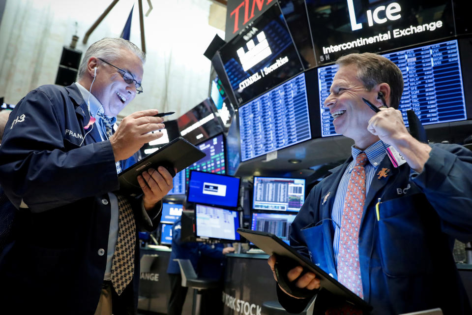 Traders work on the floor at the New York Stock Exchange (NYSE) in New York, U.S., November 4, 2019. REUTERS/Brendan McDermid