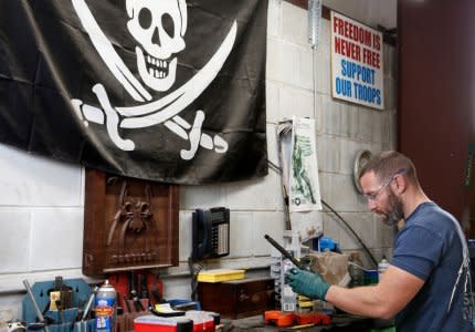 Rodger Brown finishes work on a front sight post assembly for an AR-15 style rifle barrel at Spike's Tactical LLC, a gunmaker in Apopka, Florida, U.S. December 10, 2018. Picture taken December 10, 2018. To match Insight USA-GUNS/MANUFACTURERS. REUTERS/Gregg Newton