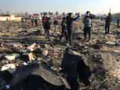 People check the debris from a plane crash belonging to Ukraine International Airlines after take-off from Iran's Imam Khomeini airport, on the outskirts of Tehran, Iran January 8, 2020. Nazanin Tabatabaee/WANA (West Asia News Agency) via REUTERS