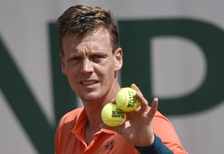 Fourth seed Tomas Berdych ousted Japanese qualifier Yoshihito Nishioka in three sets in the first round of the French Open on May 25, 2015