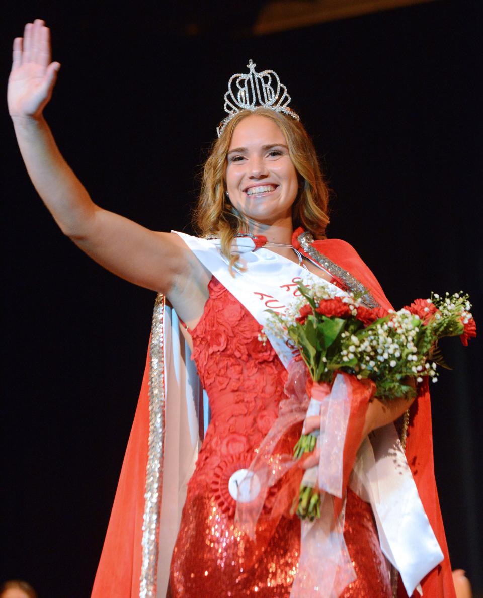 Stella Blake waves to the crowd during her championship walk on the stage after being named the 2023 Greater Alliance Carnation Festival queen on Saturday, July 29, 2023, at Alliance High School.