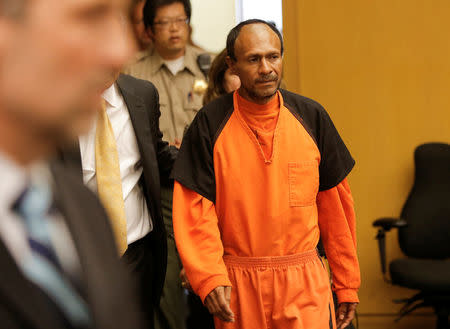 FILE PHOTO: Jose Ines Garcia Zarate, arrested in connection with the July 1, 2015, shooting of Kate Steinle on a pier in San Francisco is led into the Hall of Justice for his arraignment in San Francisco, California, U.S. on July 7, 2015. REUTERS/Michael Macor/Pool/File Photo