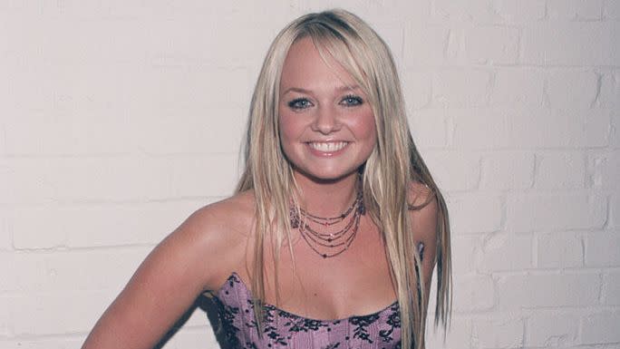best 90s fashion trends, woman, baby spice, wearing a black and purple floral corset and a black long skirt