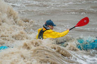 The inclement weather didn't put some people off their usual activities, like this kayaker in Clevedon, Somerset. (SWNS)