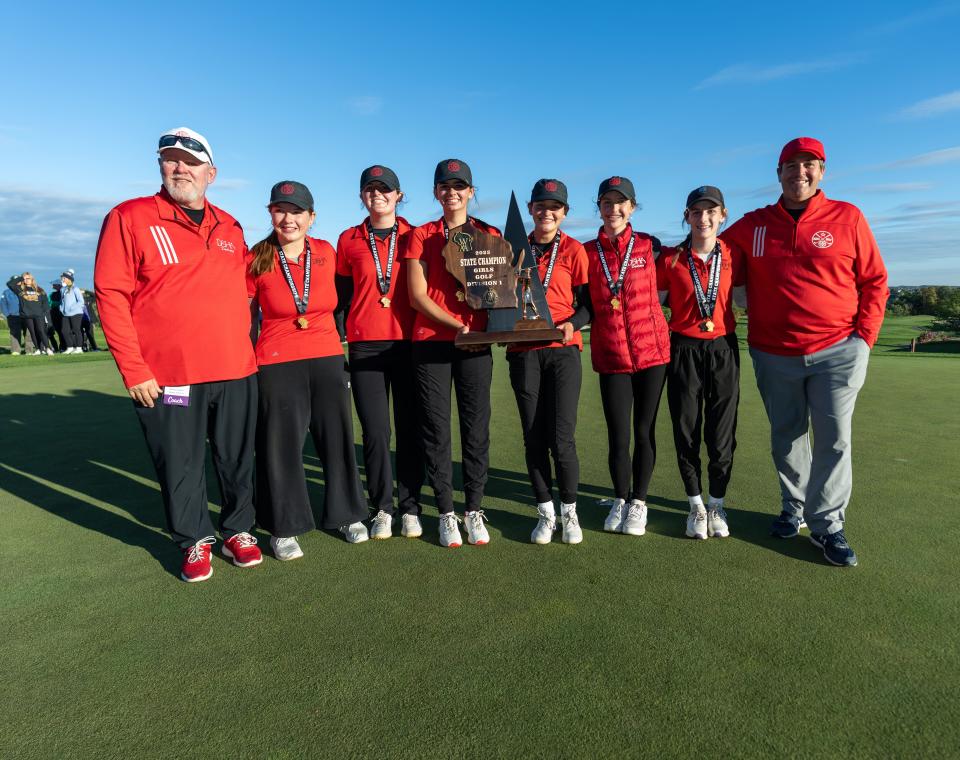 Members of the Divine Savior Holy Angels girls golf team pose with the 2023 Division 1 State Girls Golf Championship trophy at University Ridge in Madison on Tuesday, October 10.