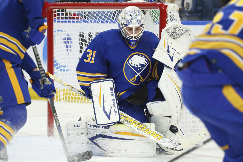 Buffalo Sabres goalie Dustin Tokarski (31) makes a stick save during the second period of an NHL hockey game against the Arizona Coyotes, Saturday, Oct. 16, 2021, in Buffalo, N.Y. (AP Photo/Jeffrey T. Barnes)