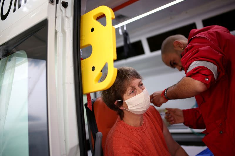 FILE PHOTO: People receive coronavirus disease (COVID-19) vaccine in Krushovitsa