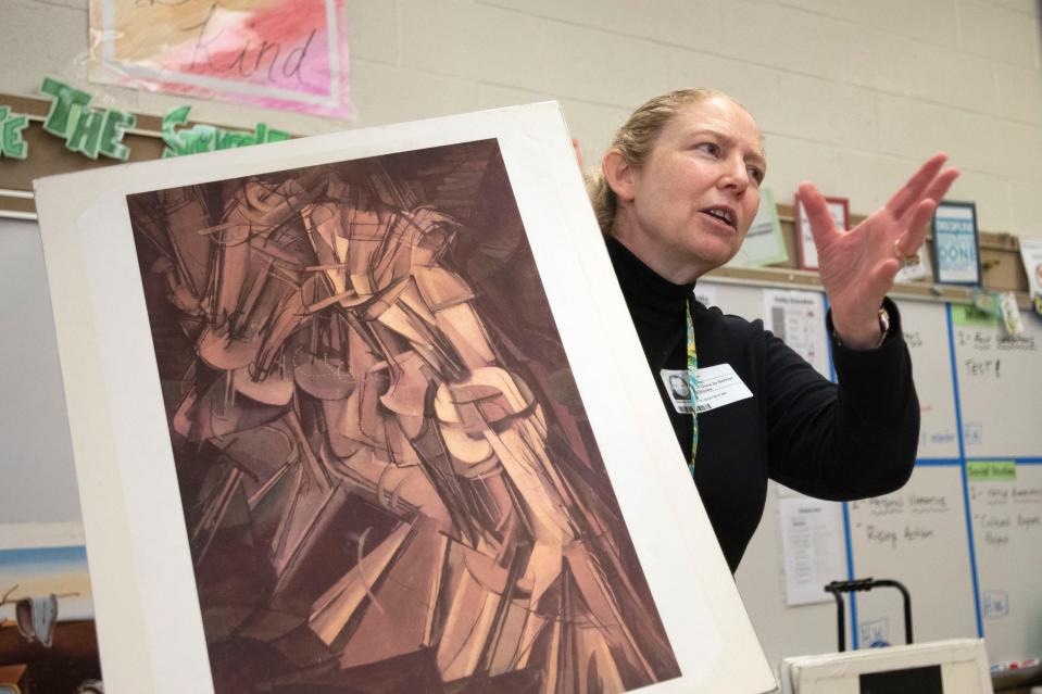 Art Goes to School volunteer Jennifer Glatt shows a photo of Marcel Duchamp's Nude Descending a Staircase No. 2 as a part of her presentation at Gayman Elementary School in Doylestown on Tuesday, Oct. 18, 2022.