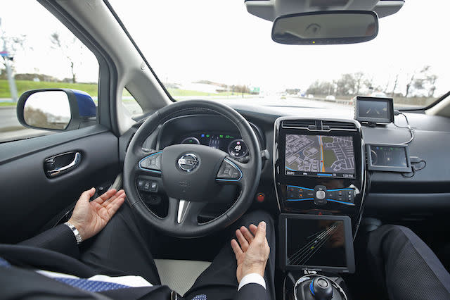 Tetsuya Lijima from Nissan giving a demonstration around the roads of east London of a prototype Nissan Leaf driverless car.