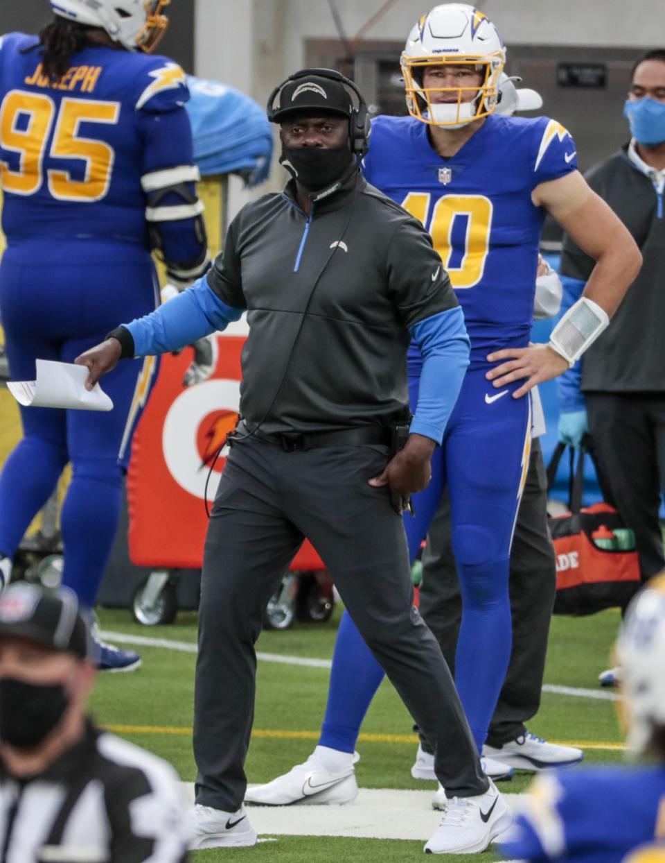 Chargers coach Anthony Lynn looks on near the end of the first half.