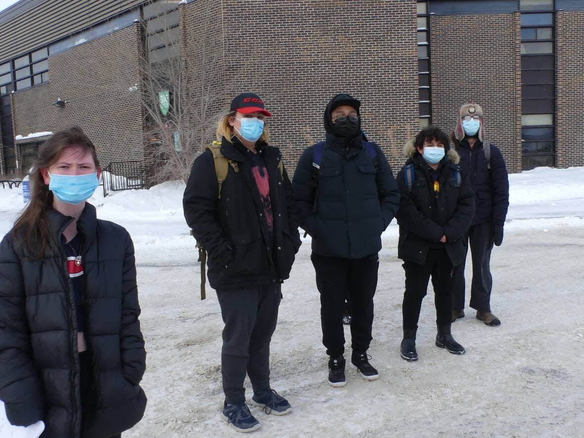 Students at Maples Collegiate assemble after walking out of class Monday morning, one of several walkouts organized in Manitoba calling on greater COVID-19 safety measures in schools.  (Justin Fraser/CBC - image credit)