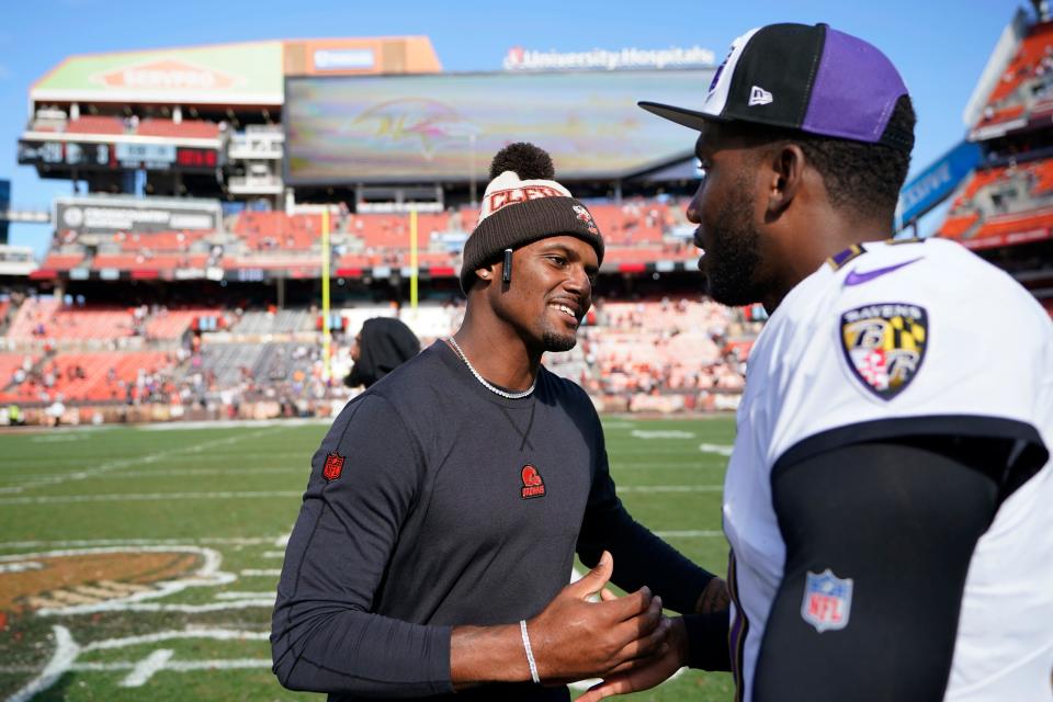 Cleveland Browns quarterback Deshaun Watson, left, shakes hands with Baltimore Ravens quarterback Josh Johnson after the teams' game Oct. 1 in Cleveland.