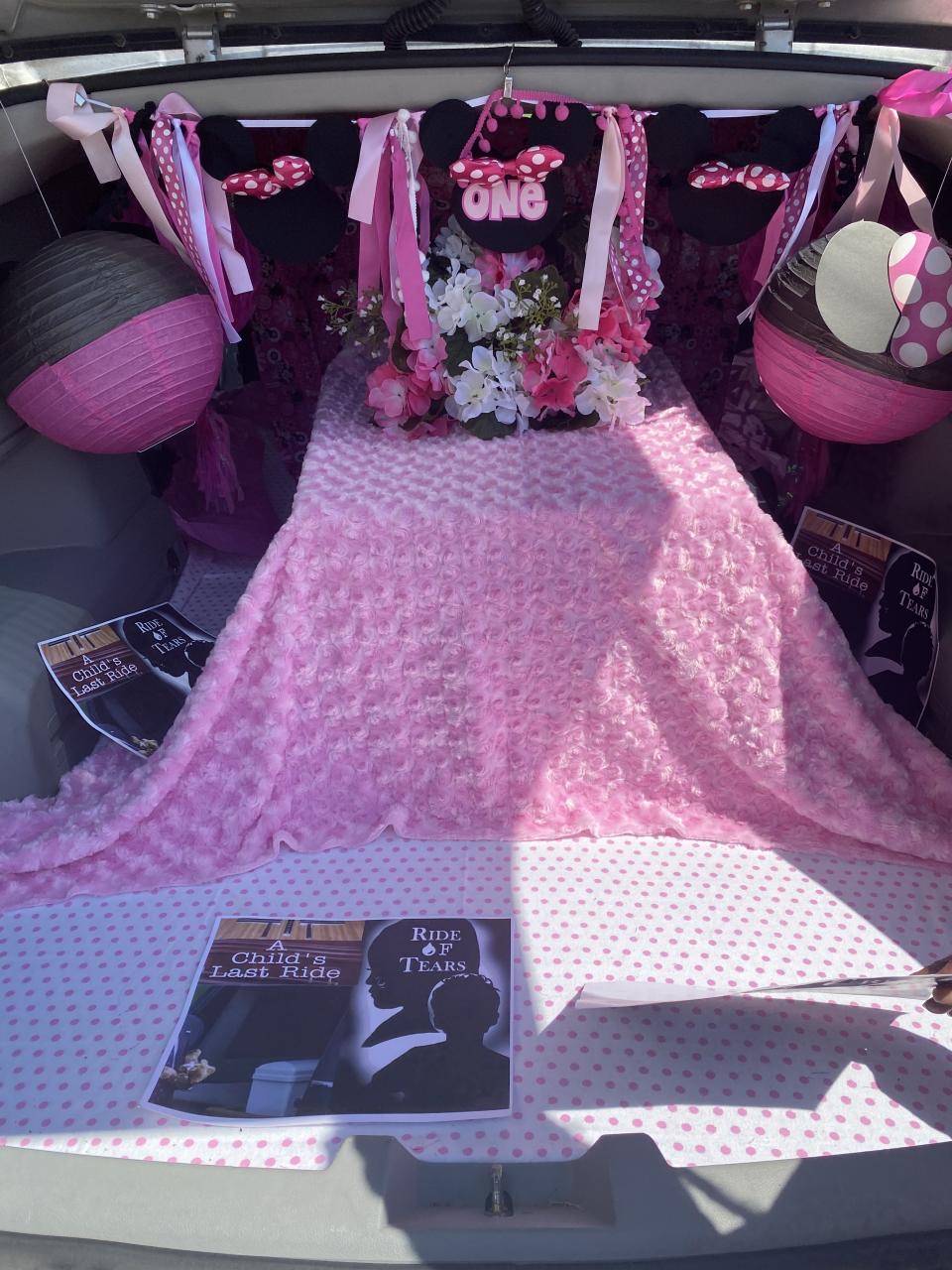 An empty child-sized casket sits in the back of a hearse that Mary Trice drives around Memphis, Tenn., to call attention to children killed by guns.<span class="copyright">Courtesy Mary Trice</span>