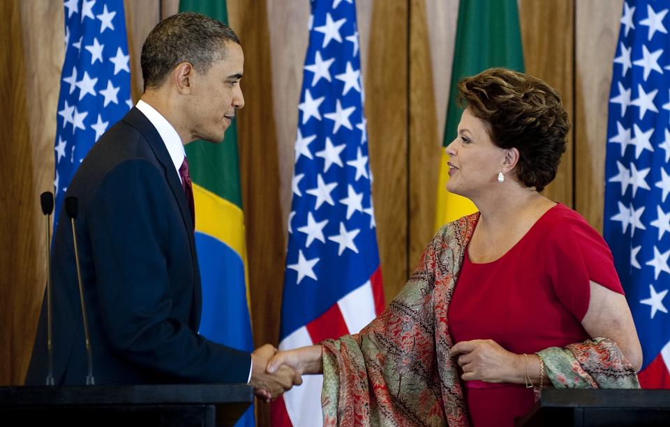 U.S. President Barack Obama shakes hands with Brazilian President Dilma Vana Rousseff during a joint press conference at Palacio do Planalto in Brasilia on March 19, 2011.&nbsp;