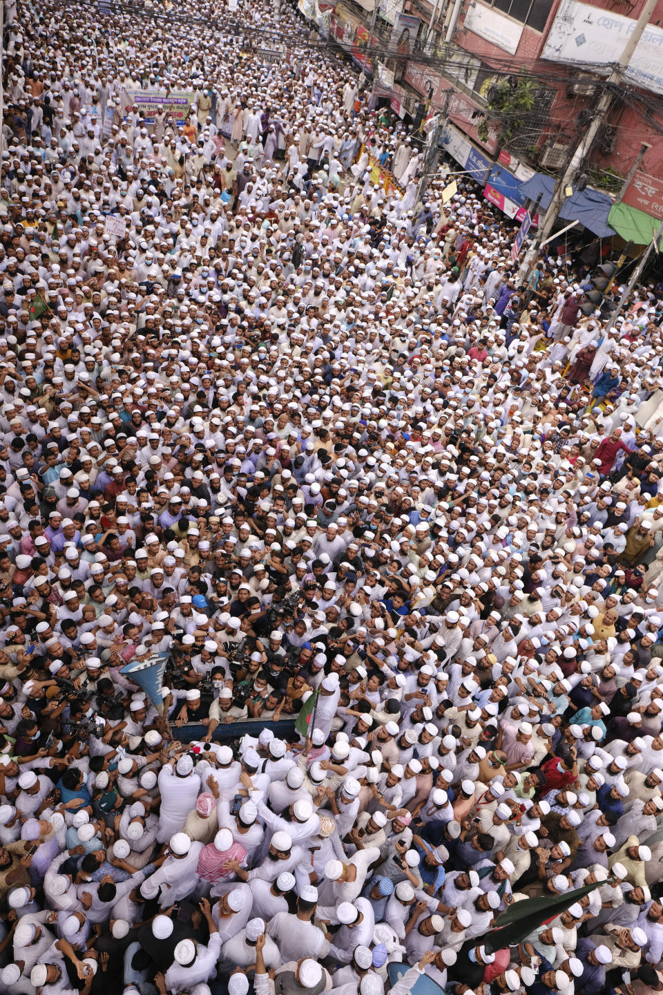 Thousands of Bangladeshi Muslims protesting the French president’s support of secular laws allowing caricatures of the Prophet Muhammad march to lay siege on the French Embassy in Dhaka, Bangladesh, Monday, Nov.2, 2020. (AP Photo/Mahmud Hossain Opu)