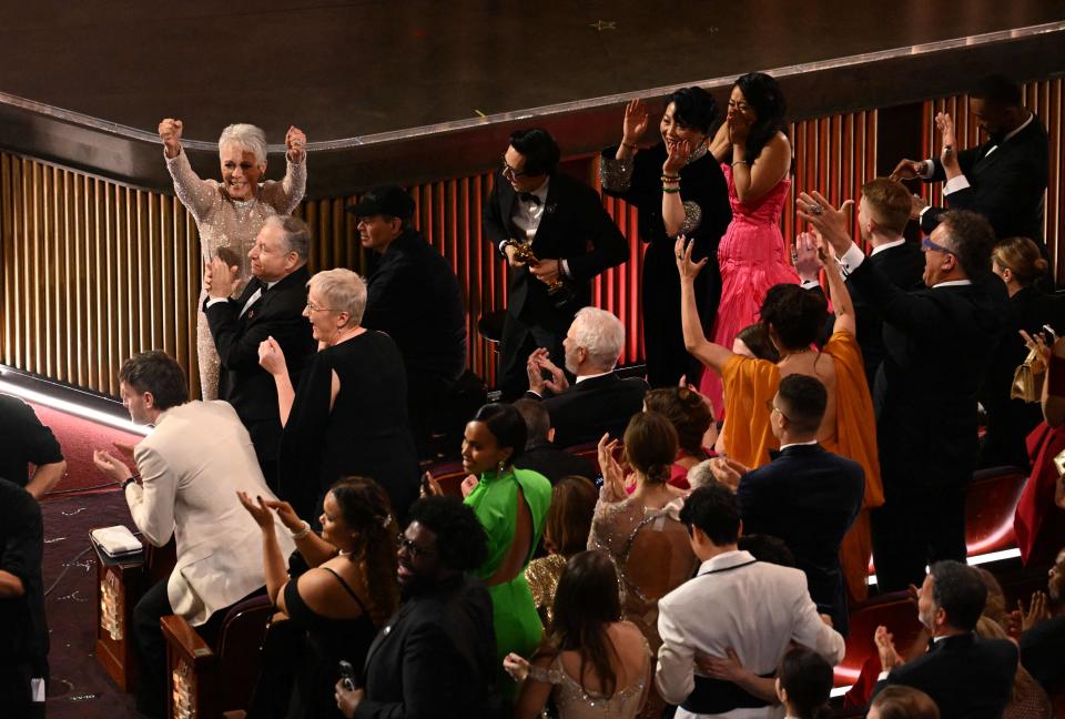 Stars celebrate after "Everything Everywhere All at Once" wins the Oscar for best picture during the 95th Annual Academy Awards at the Dolby Theatre in Hollywood.