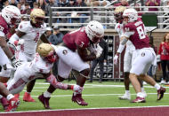 Florida State running back Trey Benson (3) scores a touchdown despite the defense of Boston College linebacker Jaylen Blackwell (8) during the first half of an NCAA college football game, Saturday, Sept. 16, 2023 in Boston. (AP Photo/Mark Stockwell)